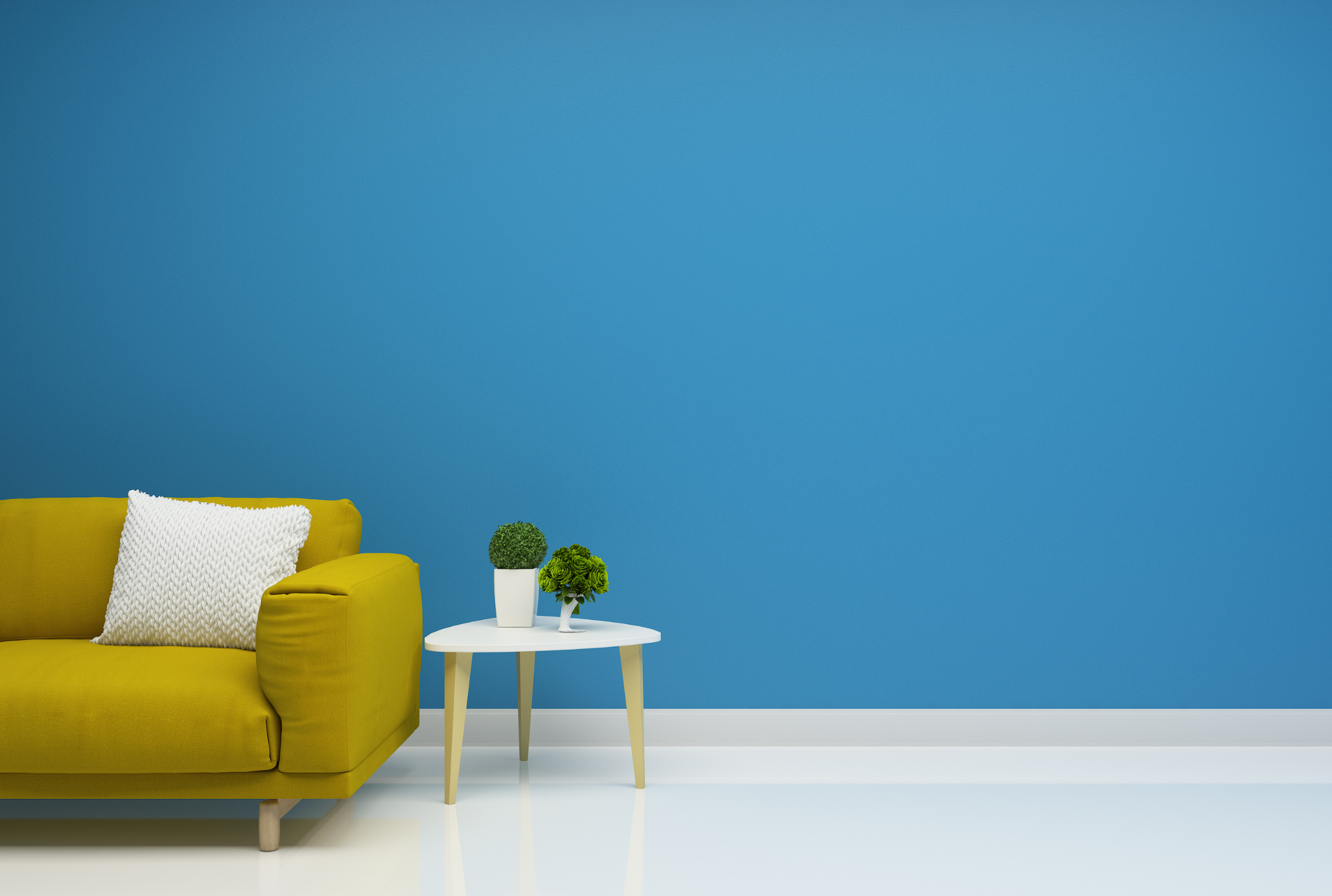 Bright living room with a yellow sofa, representing a new home